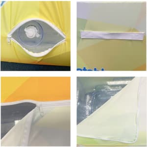 A close-up view of an inflatable two-seat sofa featuring yellow and green panels, a zippered compartment, and a transparent valve.