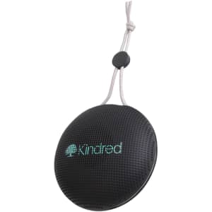 A portable, round black waterproof Bluetooth speaker with a textured surface and a hanging cord. It features a logo.