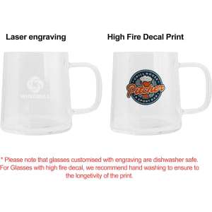 A glass mug with a clear design, featuring a logo and a colourful decal on one side.