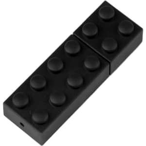 A black stackable brick flash drive, resembling a LEGO piece, with rounded stud details on the surface.