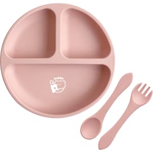 A pink silicone kids' suction plate divided into three sections, accompanied by a spoon and fork. The plate features a logo.