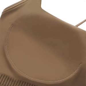 A women's seamless thin-strap U-back yoga crop bra tank in a tan colour with a smooth finish and tailored design.