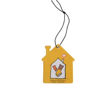 A yellow car air freshener shaped like a house, featuring an illustration of hands and a logo.