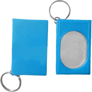 A blue pet training clicker with a metal key ring, featuring a rectangular shape and a clear, oval button.