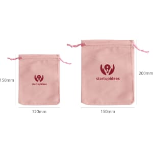 Two pink velvet drawstring bags of varying sizes, featuring a logo on the front. Dimensions are included.