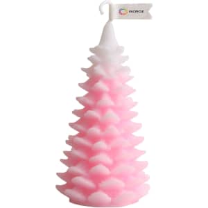 A pink Christmas tree-shaped candle with a white tip and a simple flag attached.