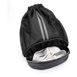 A black drawstring backpack with a compartment for shoes, featuring mesh sides and grey stripes.