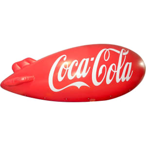 An inflatable red blimp featuring a white Coca-Cola logo, suitable for exhibitions and events.