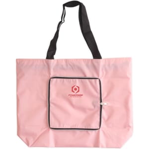 A pink foldable tote bag with black handles and a front zippered pocket. It features a logo on the front.