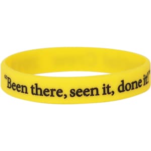 A yellow silicone wristband with debossed black text and a logo.