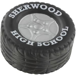 A black tire-shaped stress reliever with a grey wheel design and a logo on the side.
