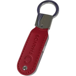 A red leather swivel flash drive with a metal keyring and branding on the surface.
