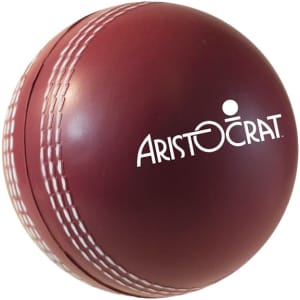 A maroon cricket ball-shaped stress reliever with white stitching and a logo.