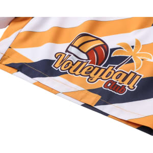 A pair of women's board shorts in yellow and white with a volleyball graphic and palm tree design. Features a drawstring and pocket.