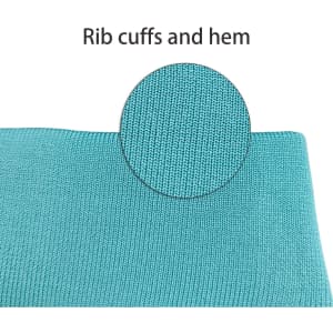 A close-up of the rib cuffs and hem of a blue polyester fabric.