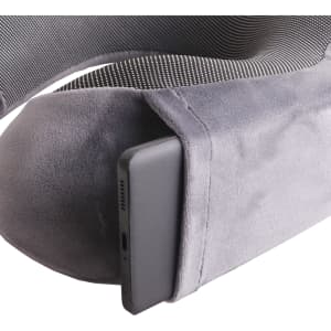 A grey memory foam U-shaped travel pillow with a pocket for a device, featuring a soft texture and supportive design.