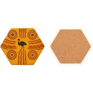 A hexagon ceramic coaster featuring a yellow design with Aboriginal art and a cork backing.