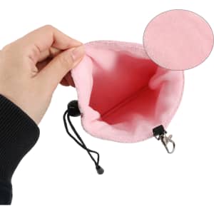 A pink PU golf valuables pouch with a soft interior, featuring a drawstring and clip for closure.
