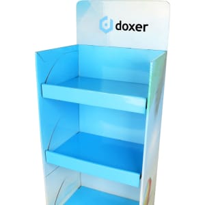 A blue cardboard floor display with three shelves and a branded header section at the top.