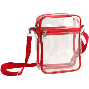 A clear tote bag with a red zipper closure and adjustable crossbody strap, featuring a transparent design.