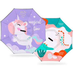 A children's reversible folding umbrella featuring a unicorn design in purple and a colourful pattern on the opposite side.