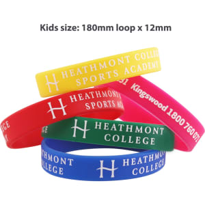 A variety of printed silicone wristbands in yellow, red, blue, and pink, featuring a logo and text.