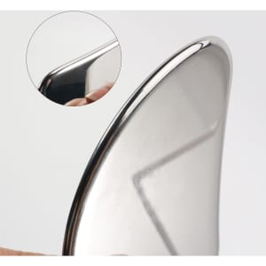 A stainless steel Gua Sha massage tool with a shiny, smooth surface and a curved edge, featuring a close-up detail.