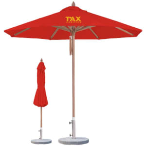 A red wind-resistant octagon outdoor umbrella with a wooden pole and a matching rolled-up umbrella beside it.