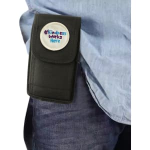 A black phone pouch with a belt clip, featuring a circular logo on the front, attached to a person’s waist.