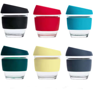 A collection of 8 oz reusable glass coffee cups in black, red, teal, dark green, yellow, and navy, each with a matching silicone lid.