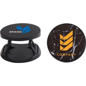 A round phone holder in black featuring two different logo designs on its surface.
