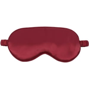 A red satin sleep mask with an elastic band, featuring a smooth, glossy surface.