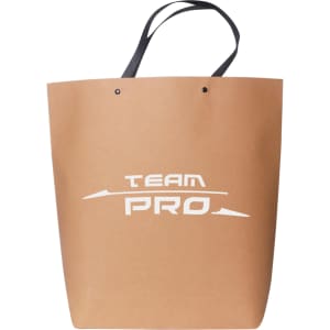 A large brown boutique paper bag with black handles and a logo on the front.