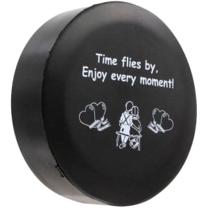 A black stress reliever in the shape of a clock, featuring white graphics and a logo.