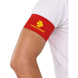 A red stretchy armband on a person's arm, featuring a logo design.
