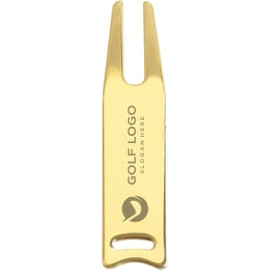 A gold golf divot tool with a logo and a two-pronged design for repairing golf greens.