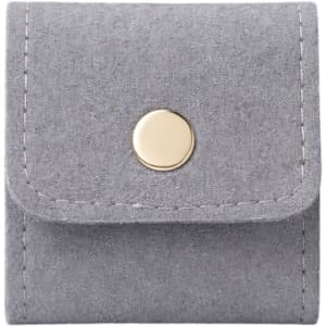 A grey synthetic leather jewellery bag with a gold button closure and stitched detailing.