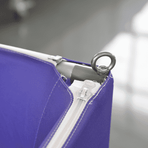 A purple hanging banner featuring a zipper and a metallic ring for attachment.