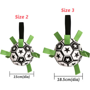 A dog soccer ball in black and white, featuring green grab tabs, available in two sizes.