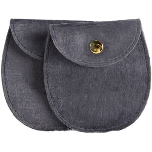 A grey oval velvet jewelry pouch featuring a snap button closure and a soft texture. It has a logo.