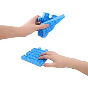 A blue Puzzle Shape Pop It fidget toy being held in one hand, with another hand touching a flat pop bubble base.