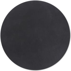 A round black cork mouse mat with a textured surface and a logo featured.