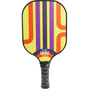 A vibrant pickleball paddle featuring a yellow, purple, and orange design, with a textured black handle and a logo.