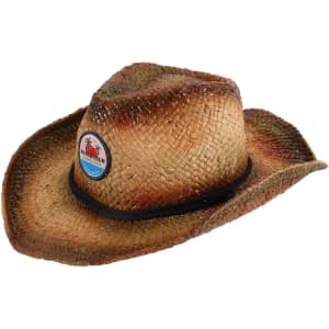 A tan straw cowboy hat with a faded brim and a logo badge on the front.