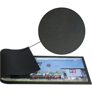 A black bar runner counter mat with a textured surface and a printed image of horses and a barn.