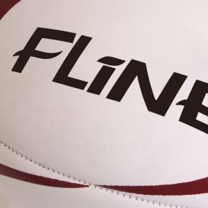 A rugby ball with a white surface and red accents, featuring a branding logo.