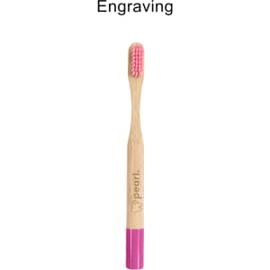 A bamboo toothbrush with a small round handle, featuring a pink brushing head and a logo.