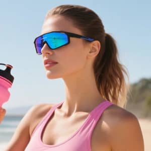 Sport sunglasses with blue-tinted lenses and a black frame, held by a woman wearing a pink tank top.