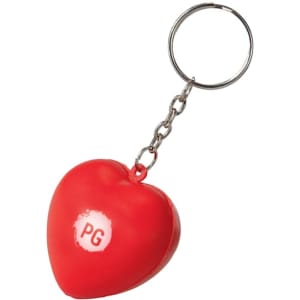 A red heart-shaped stress reliever attached to a silver keyring, featuring a small logo.