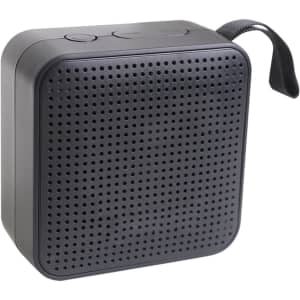 A portable wireless Bluetooth speaker in black with a textured surface and a carrying strap.